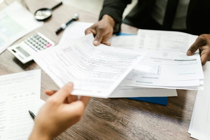 Professional reviewing Canadian administrative documents and application forms